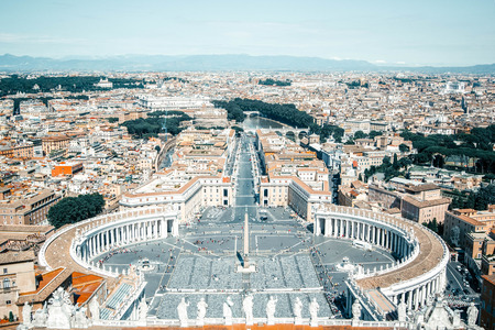 Panoramic view from the air to Saint Peter's Square, Vatican City and Rome, the Tibet River and mountains on the horizon on a summer sunny day, Italyの写真素材