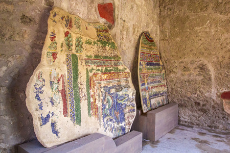 Part of the colored brick wall with painted frescoes in Pompeii, Naples, Italy. The ruins of the ancient city, excavations of Pompei scavi.のeditorial素材
