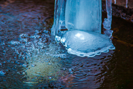 Winter waterfall in spring, close-up. Frozen water.の写真素材