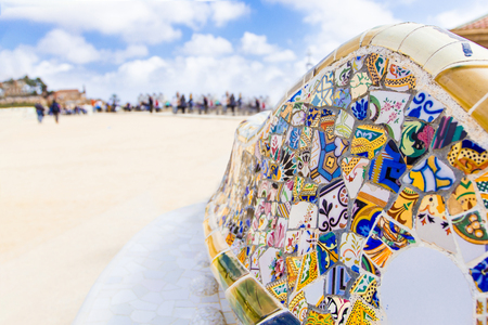 Part of element of mosaic bench/ ledge  in Park of Guell by architect Antonio Gaudi with blurry background, Barcelona, Spain.のeditorial素材