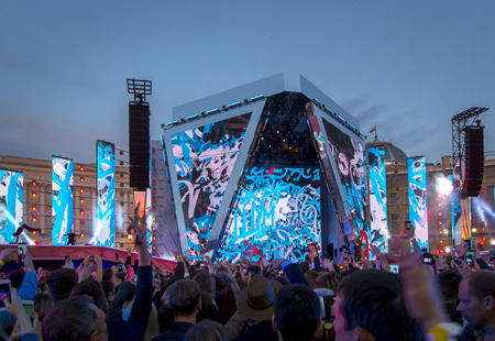 St. Petersburg, Russia - June 24, 2018: Concert, show with bright lights and silhouettes of merry people, graduates on holidayのeditorial素材