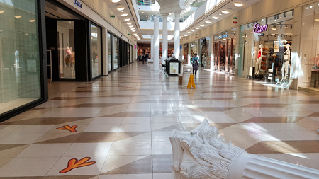 ST-PETERSBURG, RUSSIA - APRIL 16, 2019: Modern shopping center EUROPOLIS with blue windows on light background. Mall high fashion.のeditorial素材