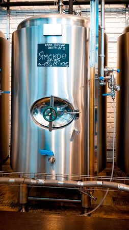 ORENBURG, RUSSIA - JULY 1, 2019: Steel stainless tanks for beer fermentation and maturation in modern private brewery, beer factory.のeditorial素材