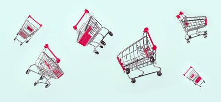 Set of flying metal grocery shopping basket, shopping car isolated on light blue background, banner....