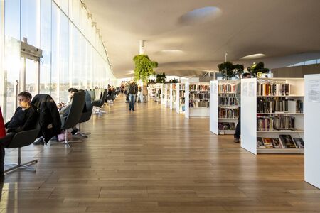 HELSINKI, FINLAND - JANUARY 05, 2020: Helsinki Central Library Oodi, living meeting place with range of services in modern design in city center. Interior inside with glass windows, wooden facadeのeditorial素材