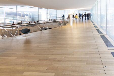 HELSINKI, FINLAND - JANUARY 05, 2020: Helsinki Central Library Oodi, living meeting place with range of services in modern design in city center. Interior inside with glass windows, wooden facadeのeditorial素材
