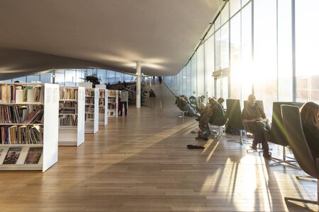 HELSINKI, FINLAND - JANUARY 05, 2020: Helsinki Central Library Oodi, living meeting place with range of services in modern design in city center. Interior inside with glass windows, wooden facadeのeditorial素材