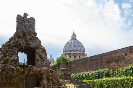 VATICAN, VATICAN CITY - JUNE 16, 2014: View at St Peter's Basilica (Basilica di San Pietro) from Vatican Gardens and Eagle Fountain, Rome, Italy.のeditorial素材
