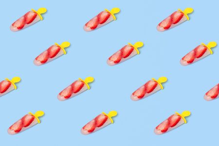 Trendy summer pattern made of strawberry ice cream  on blue isometric background. Minimal geometry style.の写真素材