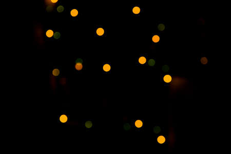 Multicolored colorful bokeh lights on abstract dark background