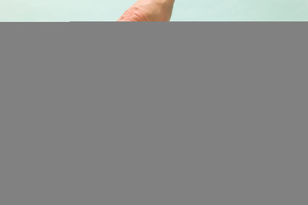 Woman's hand puts blank wooden cube on top of each other. Concept of logical thinking. Abstract...
