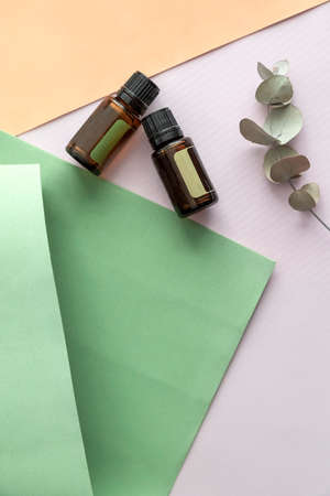 Glass bottles of natural oil ingredients on marble background. Eco-friendly concept of beauty. Natural organic skincare. Top view, flat lay.の写真素材