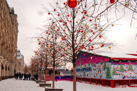 Moscow, Russia - February 21, 2021: GUM ice rink on Red Square with colorful lights on snowy winter day in Moscow, Russiaのeditorial素材