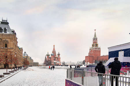 Moscow, Russia - February 21, 2021: Moscow Kremlin with Spassky Tower and Saint Basil's Cathedral in center city on Red Square in snowy winter, Moscow, Russia.のeditorial素材