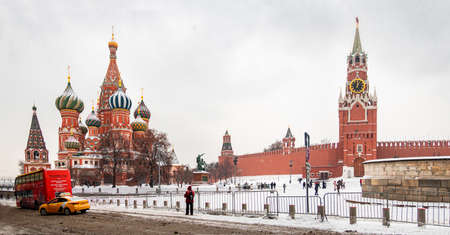 Moscow Kremlin with Spassky Tower and Saint Basils Cathedral in center city on Red Square in snowy winter, Moscow, Russiaのeditorial素材