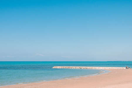 Beautiful landscape with white sand beach. Panoramic view on blue sky and azure coast sea on natural background. Luxury summer vacation.の写真素材