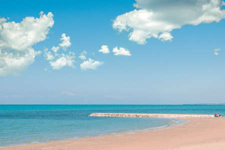 Beautiful landscape with white sand beach. Panoramic view on blue sky and azure coast sea on natural background. Luxury summer vacation.の写真素材