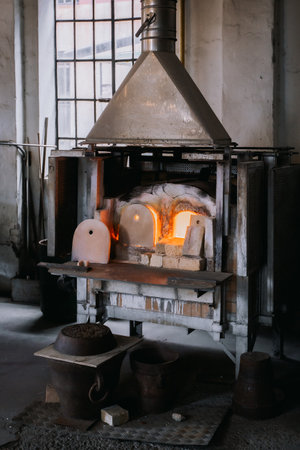 Venice, Italy - July 28, 2013: Master glassblower works in workshop on creation of glass souvenirs, Murano in Venice, Italyのeditorial素材
