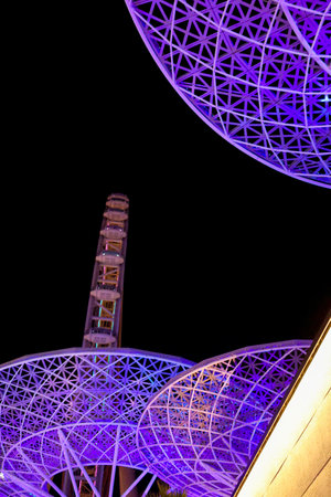 Bluewaters Island at night. Walking area promenade with huge neon glowing trees mushrooms. Jumeirah Beach Residence coastline. Dubai Marinaのeditorial素材