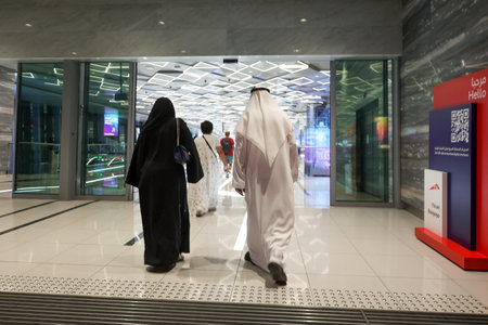 People walk to entrance to Dubai metro station at EXPO 2020. Modern design of underground station