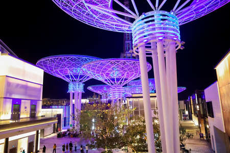 Bluewaters Island at night. Walking area promenade with huge neon glowing trees mushrooms. Jumeirah...