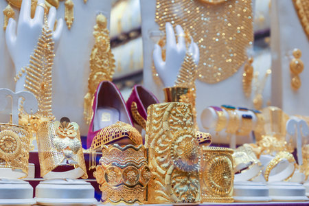 UAE, Dubai - November 29, 2021: Elegant shiny jewelry in shop window. Gold market in old town of Dubai. Jewelry Bazaar. Gold Souk in Sharjahのeditorial素材