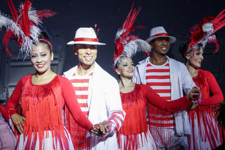 Dubai, UAE - November 30, 2021: Expo 2020. National dances in pavilion of Brazil. Dancers in colorful costumes during carnival performanceのeditorial素材