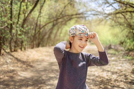 Portrait of cheerful laughing girl in spring park. High quality photoの写真素材
