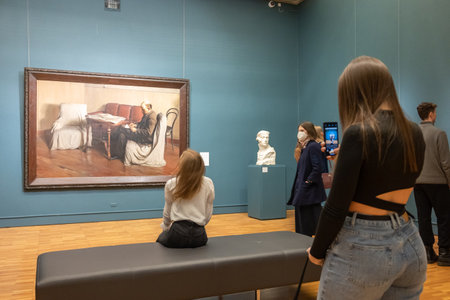 Moscow, Russia - April 2, 2022: State New Tretyakov Gallery on Krymsky Val. People look at paintings...