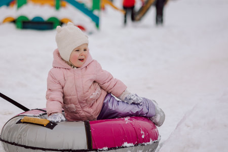 Dad giving high five little girl on walk in winter snowy day. High quality photoの写真素材