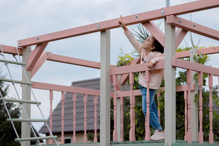Little girl walks outdoors on sunny summer day. Joyful emotions. Joy of childhood. High quality photoの写真素材