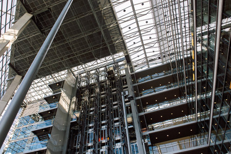 Helsinki, Finland - August 22, 2022: Sanomatalo is business office building. Newspaper house in modern design. Interior inside building with glass windowsのeditorial素材