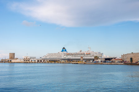 Rhodes, Greece - August 24, 2022: Panoramic view of beautiful yachts, tourist ferries stand in harbor in port of Rhodes, Greece.のeditorial素材