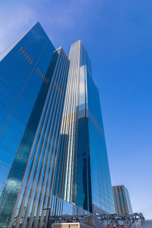 High-rise mirror towers of modern office buildings business center of Abu Dhabi Plaza, Astana,...