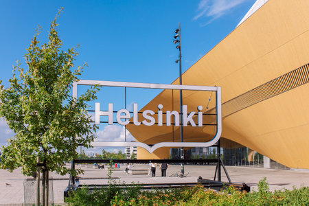 Helsinki, Finland - August 22, 2022: Helsinki sign. Central Library Oodi with wooden circular roof. Living meeting place with range of services in modern design at Kansalaistori Square.のeditorial素材