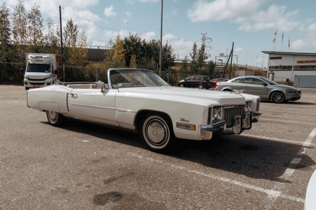 Helsinki, Finland - August 22, 2022: Classic american Cadillac car in store parking. White luxury retro vintage automobile.のeditorial素材