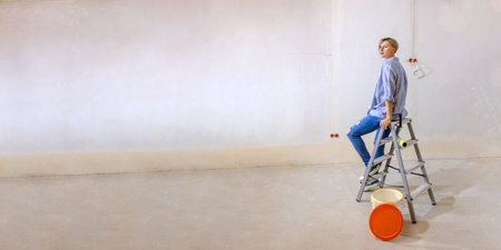 Woman in new apartment with dreams about new life. Renovation in new apartment. Repair work of home. High quality photoの写真素材