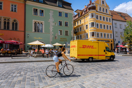 Regensburg, Germany - July 20, 2023: Colorful houses in old streets of Regensburg, eastern Bavaria,...