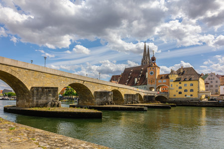 Regensburg, Germany - July 20, 2023: Panoramic view of Historical Stone Bridge and Bridge tower in Regensburg on river Danube, Regensburg, Bavaria, Germanyのeditorial素材