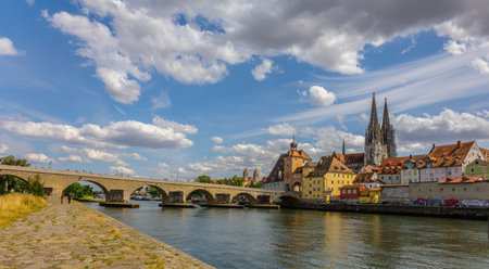 Regensburg, Germany - July 20, 2023: Panoramic view of Historical Stone Bridge and Bridge tower in Regensburg on river Danube, Regensburg, Bavaria, Germanyのeditorial素材