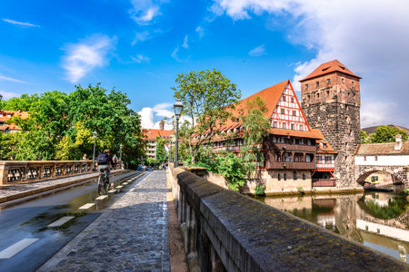 Nuremberg, Germany - July 26, 2023: Colourful historic old town with half-timbered houses of Nuremberg. Bridges over Pegnitz river. Nurnberg, eastern Bavaria, Germany. High quality photoのeditorial素材