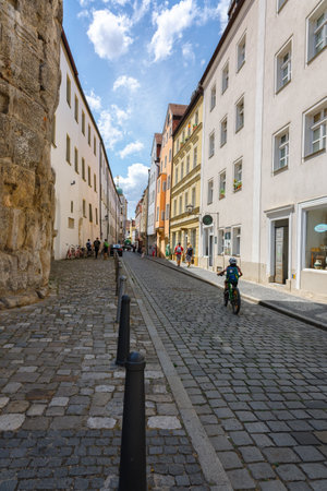 Regensburg, Germany - July 20, 2023: Colorful houses in old streets of Regensburg, eastern Bavaria, Germany. Vertical photoのeditorial素材