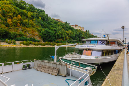 Passau, Germany - July 21, 2023: River ships, boats and powerboat moored on banks of Danube Riverのeditorial素材