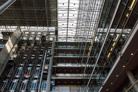 Helsinki, Finland - August 22, 2022: Sanomatalo is business office building. Newspaper house in modern design. Interior inside building with glass windowsのeditorial素材