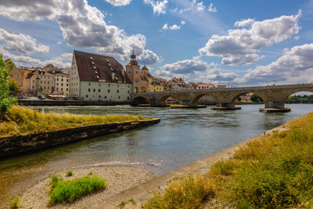 Regensburg, Germany - July 20, 2023: Panoramic view of Historical Stone Bridge and Bridge tower in Regensburg on river Danube, Regensburg, Bavaria, Germanyのeditorial素材