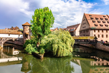 Nuremberg, Germany - July 26, 2023: Colourful historic old town with half-timbered houses of Nuremberg. Bridges over Pegnitz river. Nurnberg, eastern Bavaria, Germany. High quality photoのeditorial素材
