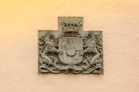 Passau, Germany - July 21, 2023: Old coat of arms in form of bas-relief on wall of house, Passau, Bavaria, Germany.のeditorial素材