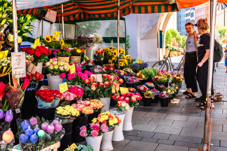 Munich, Germany - July 22, 2023: Selling colorful flowers and bouquets on street of Munichのeditorial素材
