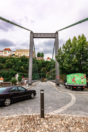 Passau, Germany - July 21, 2023: View of suspension bridge in Danube river. City life, urban studies, Bavaria, Germany.のeditorial素材