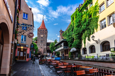 Nuremberg, Germany - July 26, 2023: Street cafes, embankment in old town of Nuremberg, Bavaria.